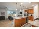 Open kitchen with granite counters, stainless steel appliances, and an island facing the living area at 6317 Vista Cliff Loop, Castle Rock, CO 80104
