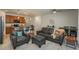 Living room featuring a gray sofa and loveseat facing the open concept kitchen with a kitchen island at 6317 Vista Cliff Loop, Castle Rock, CO 80104