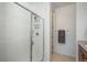 Modern tiled shower with glass doors and built-in shelving, offering a spa-like experience at 6317 Vista Cliff Loop, Castle Rock, CO 80104