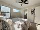 Bright bedroom with ceiling fan and ensuite bathroom access at 2176 S Birch St, Denver, CO 80222