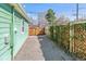 Charming backyard featuring a wooden gate and a fence covered in lush greenery at 4054 Wyandot St, Denver, CO 80211