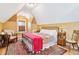 Comfortable bedroom with sloped ceilings, large area rug and decor at 4054 Wyandot St, Denver, CO 80211