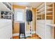 Organized walk-in closet with built-in shelving and storage space near window at 4054 Wyandot St, Denver, CO 80211