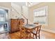 Charming dining room featuring wood floors, natural light and an adjacent staircase at 4054 Wyandot St, Denver, CO 80211