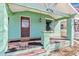 Inviting front porch featuring a wood deck and a stylish front door at 4054 Wyandot St, Denver, CO 80211