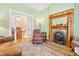 Comfortable living room featuring a classic fireplace and hardwood floors at 4054 Wyandot St, Denver, CO 80211