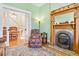 Comfortable living room featuring a classic fireplace and hardwood floors at 4054 Wyandot St, Denver, CO 80211