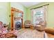 Cozy living room featuring a classic fireplace and hardwood floors at 4054 Wyandot St, Denver, CO 80211