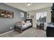 Cozy bedroom with wood bed frame, plush toy, and decorative wall art at 946 Gooseberry Ct, Elizabeth, CO 80107