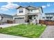 Two-story house with gray siding, a large yard, and a two-car garage at 946 Gooseberry Ct, Elizabeth, CO 80107