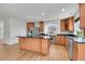 Spacious kitchen with a large island, stainless steel appliances, and ample cabinet space, ideal for cooking and entertaining at 5131 Netherland St, Denver, CO 80249