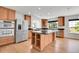 Spacious kitchen with a large island, stainless steel appliances, and ample cabinet space, ideal for cooking and entertaining at 5131 Netherland St, Denver, CO 80249