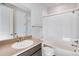 Bathroom featuring a bathtub with shower and a large sink at 1419 Great Western Dr, Longmont, CO 80501