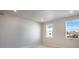 Spacious bedroom with recessed lighting and two bright windows at 1419 Great Western Dr, Longmont, CO 80501