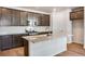 Modern kitchen featuring granite countertops, stainless steel appliances, and dark wood cabinetry at 1419 Great Western Dr, Longmont, CO 80501