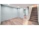 Unfinished basement with new laminate flooring and high ceilings at 68 W 81St Pl, Denver, CO 80221