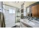 Clean bathroom with a shower/tub combo and updated vanity at 68 W 81St Pl, Denver, CO 80221