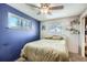 Spacious bedroom with a double bed and blue walls at 68 W 81St Pl, Denver, CO 80221