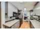 Bright kitchen featuring granite countertops and modern appliances at 68 W 81St Pl, Denver, CO 80221