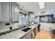 Kitchen with granite countertops and gray cabinets at 68 W 81St Pl, Denver, CO 80221