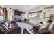 Living room with fireplace and brown leather furniture at 68 W 81St Pl, Denver, CO 80221