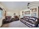 Spacious living room with brown leather furniture at 68 W 81St Pl, Denver, CO 80221