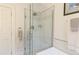 Beautiful bathroom featuring a glass shower with marble tiling and a decorative tile accent stripe at 1434 Osceola St, Denver, CO 80204