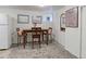 Basement dining area showcasing wood table, decorative rug, and a side door fridge at 1434 Osceola St, Denver, CO 80204