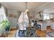 Inviting dining room with hardwood floors, archway to the kitchen and lots of natural light at 1434 Osceola St, Denver, CO 80204