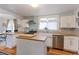 Open kitchen design with butcher block island and counters, stainless appliances, and open shelving at 1434 Osceola St, Denver, CO 80204