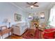 Cozy living room featuring hardwood floors, stained glass windows, and ample natural light at 1434 Osceola St, Denver, CO 80204