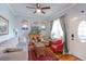 Comfortable living room with hardwood floors, a decorative fireplace and a large window at 1434 Osceola St, Denver, CO 80204