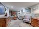 Comfortable basement living room offering wood-look flooring, recessed lighting and artistic decorations at 1434 Osceola St, Denver, CO 80204