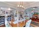 Open-concept living space with dining area, kitchen, and hardwood floors at 1434 Osceola St, Denver, CO 80204