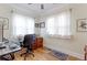 Well-lit home office with hardwood floors, two large windows, and traditional decor throughout at 1434 Osceola St, Denver, CO 80204