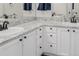 Close-up of the bathroom vanity with dual sinks and granite countertops at 527 English Sparrow Trl, Highlands Ranch, CO 80129