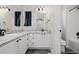 Bright bathroom with dual sinks, granite countertops, and updated fixtures at 527 English Sparrow Trl, Highlands Ranch, CO 80129