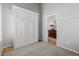 Bedroom with a Murphy bed, hardwood floors, neutral paint, closet, and open doorway to another room at 527 English Sparrow Trl, Highlands Ranch, CO 80129