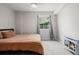 Bedroom featuring a ceiling fan, window, and a cozy fireplace at 527 English Sparrow Trl, Highlands Ranch, CO 80129