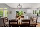 Charming dining room with wooden table set, adjacent to the kitchen and outdoor deck area at 527 English Sparrow Trl, Highlands Ranch, CO 80129
