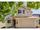 Charming two-story home with a two-car garage, neutral siding, and well-maintained landscaping at 527 English Sparrow Trl, Highlands Ranch, CO 80129