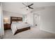 Spacious main bedroom featuring vaulted ceilings, ceiling fan, and en-suite bathroom at 527 English Sparrow Trl, Highlands Ranch, CO 80129