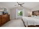 Spacious main bedroom with vaulted ceiling, large window, and tasteful furnishings at 527 English Sparrow Trl, Highlands Ranch, CO 80129
