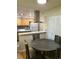 Bright dining area with a round table next to the kitchen and great natural light at 9105 E Lehigh Ave # 105, Denver, CO 80237