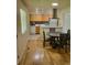Cozy dining area featuring a round table and chairs, adjacent to the kitchen for easy access at 9105 E Lehigh Ave # 105, Denver, CO 80237