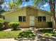 Charming single-story home with a brick facade, well-maintained landscaping, and inviting entryway at 9105 E Lehigh Ave # 105, Denver, CO 80237