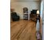 Inviting living area showcasing hardwood floors, seating, and ample natural light at 9105 E Lehigh Ave # 105, Denver, CO 80237