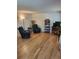 Cozy living room featuring hardwood floors, comfortable seating, and natural light at 9105 E Lehigh Ave # 105, Denver, CO 80237