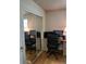 Bright office features a sliding closet door, and convenient desk arrangement for focused work at 9105 E Lehigh Ave # 105, Denver, CO 80237