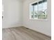 Bright bedroom with large windows and modern light gray flooring at 8245 Cokedale Cir, Littleton, CO 80125